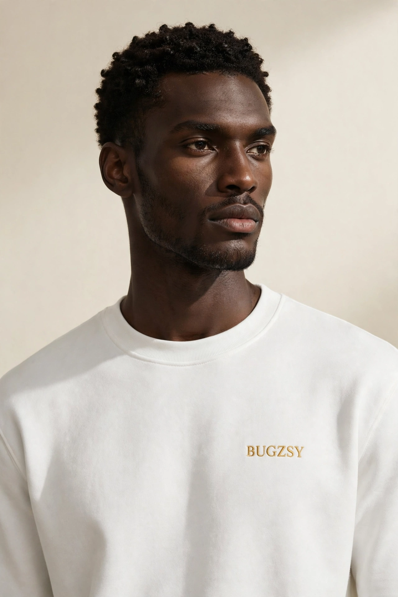 Tall Black male model wearing the white Bugzsy Christmas crewneck